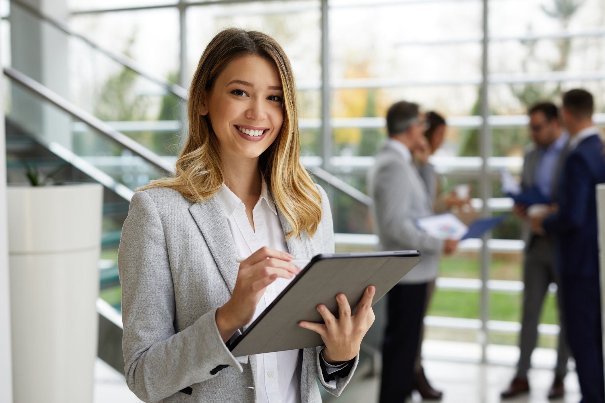 Young businesswoman with digital tablet at work