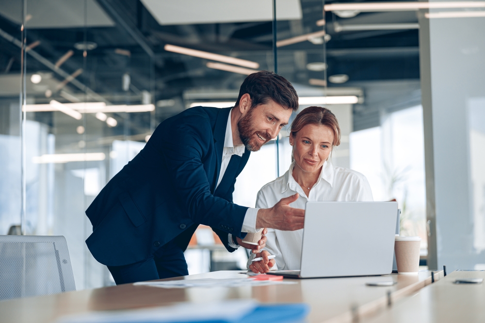 Female boss discussing findings with her male colleague