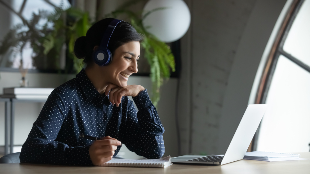 Woman speaking to customer with a headset